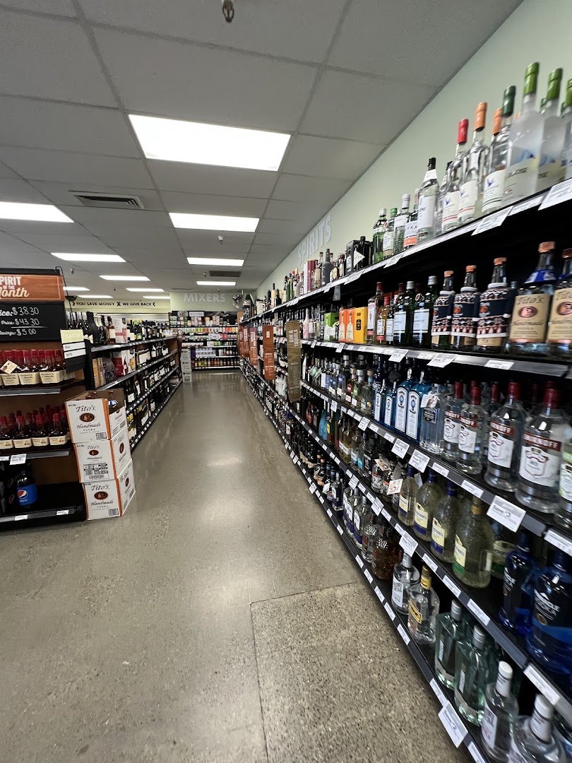 Retail displays arranged under bright store lighting.