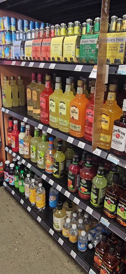 Retail displays arranged under bright store lighting.